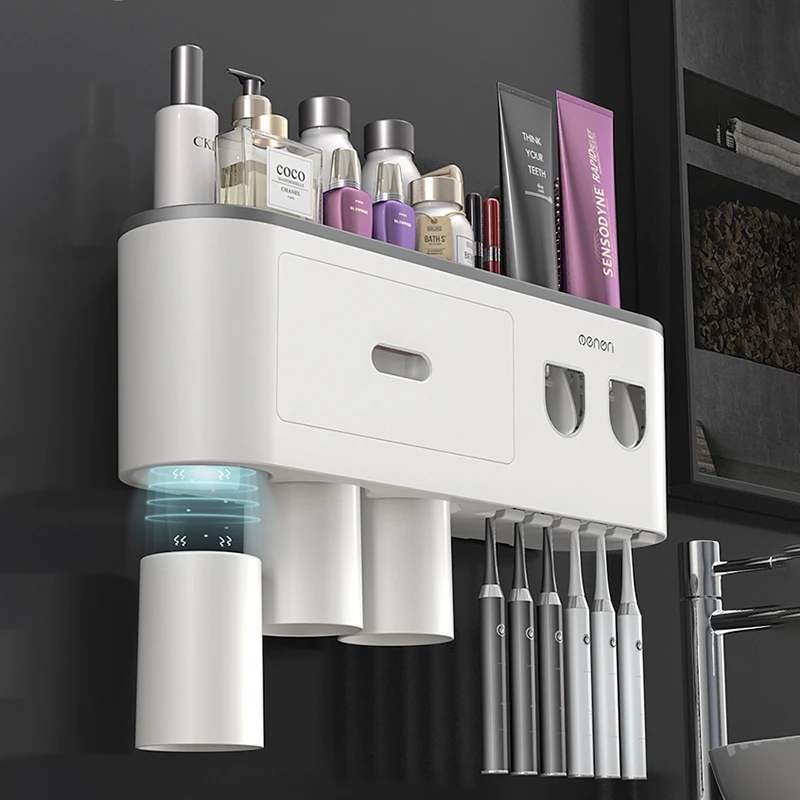 Close-up of the dual toothpaste dispenser on the Ultimate Bathroom Toothbrush Organizer, showing toothpaste tubes inserted